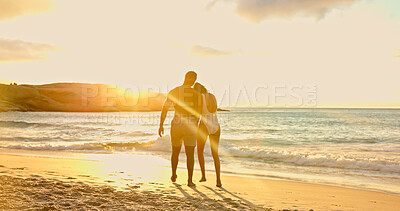 Buy stock photo Couple, walk and sunset at beach on vacation with back, bonding and love with relationship in summer. Man, woman and partnership with swimwear, connection and space with waves on seaside holiday
