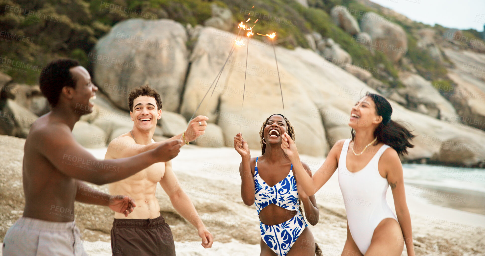 Buy stock photo Sparklers, beach and laugh with friends on vacation, travel together or celebrate new year. Fireworks, ocean or excited people on holiday, party or funny joke in summer at social gathering with group