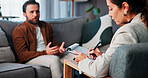 Clipboard, consulting and therapy with people in clinic together for mental healthcare, help or support. Psychology, talking and therapist writing with patient in office for healing or rehabilitation