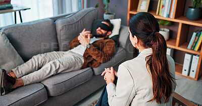 Buy stock photo Hypnotherapy, psychology and talking with people in clinic together for mental health, help or support. Consulting, sensory deprivation and therapist speaking to patient in office for rehabilitation
