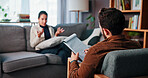 Woman, counseling or talking with therapist for advice, rehabilitation or therapy session on sofa. Female person, client or discussion with counselor, psychologist or help for mental health in office