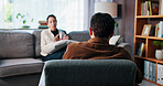 Woman, patient and talking with psychologist for counseling, rehabilitation or therapy session. Female person, client and speaking with counselor or therapist for help or advice on sofa in office