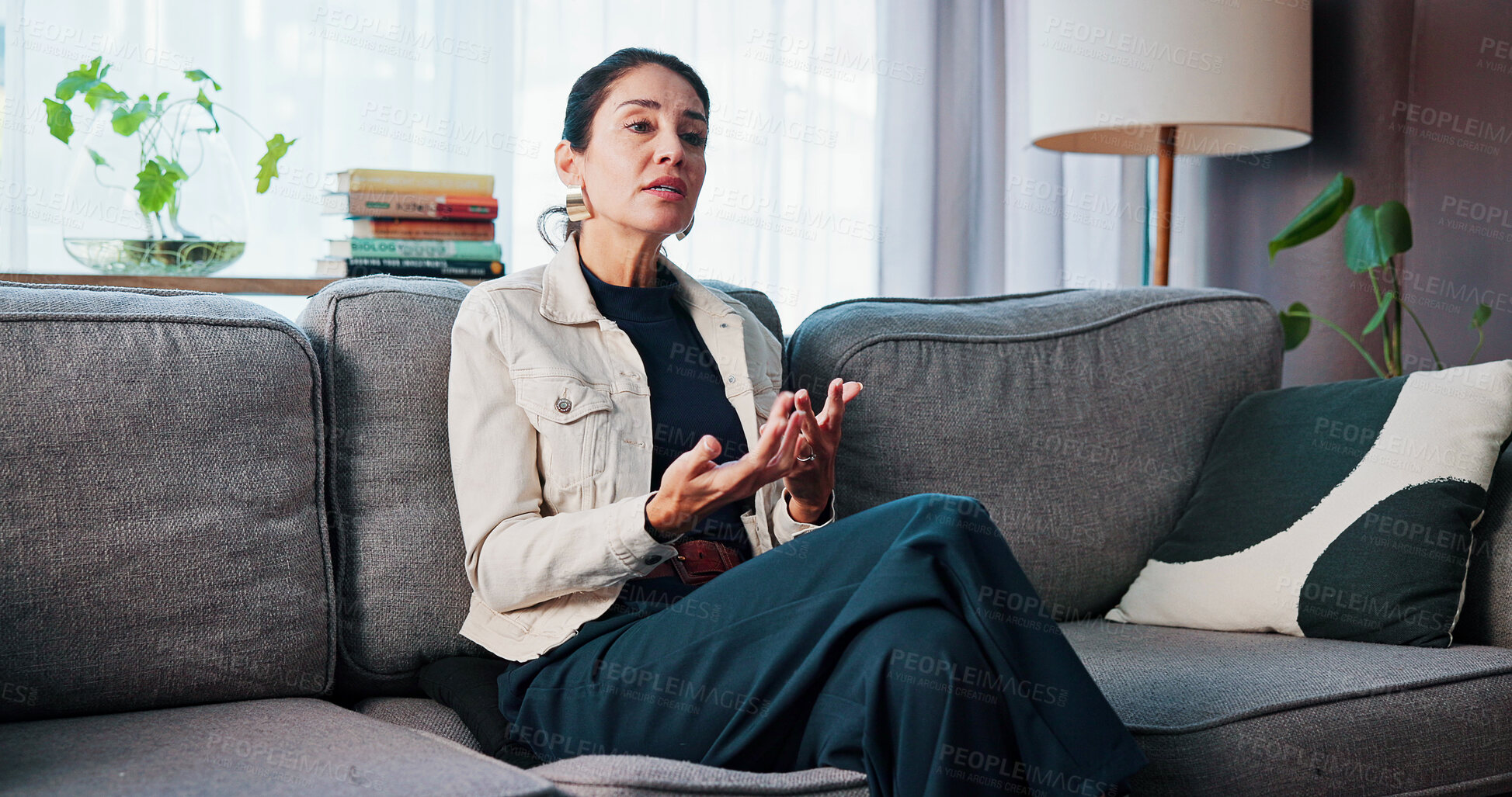 Buy stock photo Psychology, speaking and woman on sofa for therapy, mental health support and counseling for ptsd. Explain experience, talk and mature person in session for trauma healing, express fears and office