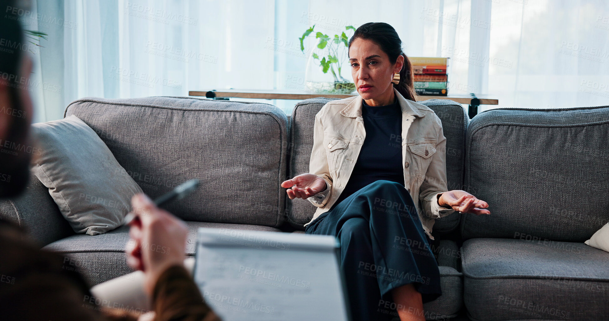 Buy stock photo Mental health, counseling or woman in office with notes, frustration or therapy in clinic visit. Stress, patient or psychologist with writing, support or anxious explanation in trauma session.