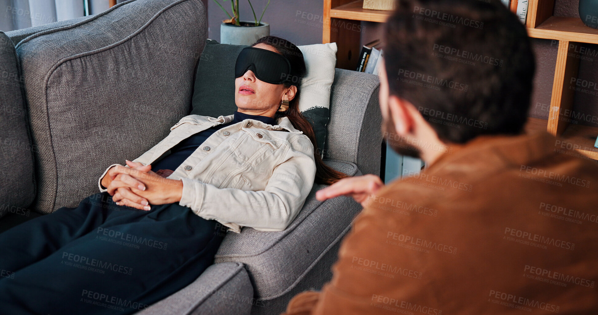 Buy stock photo Consulting, eye mask and therapy with people in clinic together for mental healthcare, help or support. Hypnosis, psychology and therapist speaking to patient in office for healing or rehabilitation