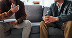 Mental health, counseling or hands in office with notes, evaluation or therapy in clinic visit. Men, patient or psychologist on sofa with writing pad, emotional support or advice in trauma session.