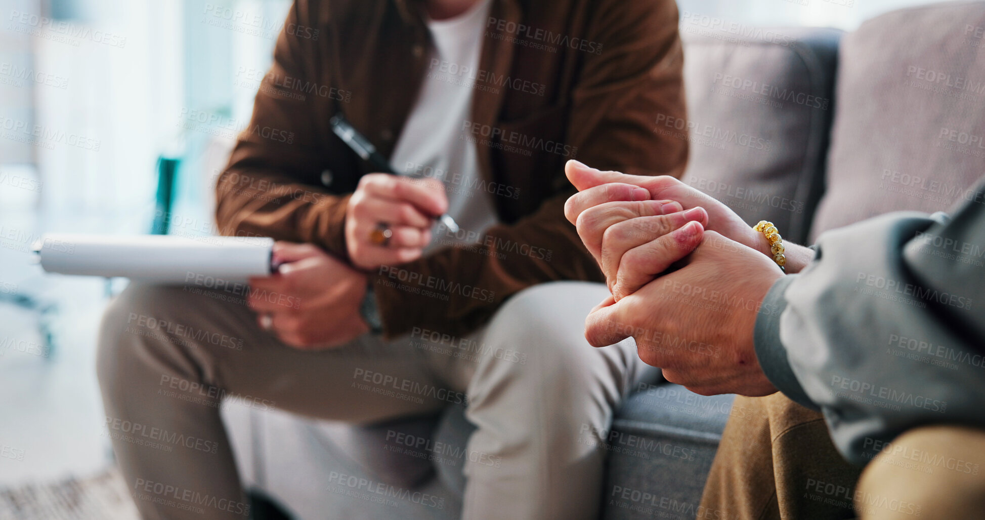 Buy stock photo Mental health, counseling or hands in clinic with notes, evaluation or therapy in office visit. People, patient or psychologist on sofa with writing pad, emotional support or advice in trauma session