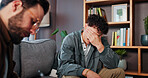 Psychologist, man and crying in grief counseling on sofa for loss, trauma evaluation and advice. Mental health, doctor and sad male patient in therapy for consulting, emotional support and assessment