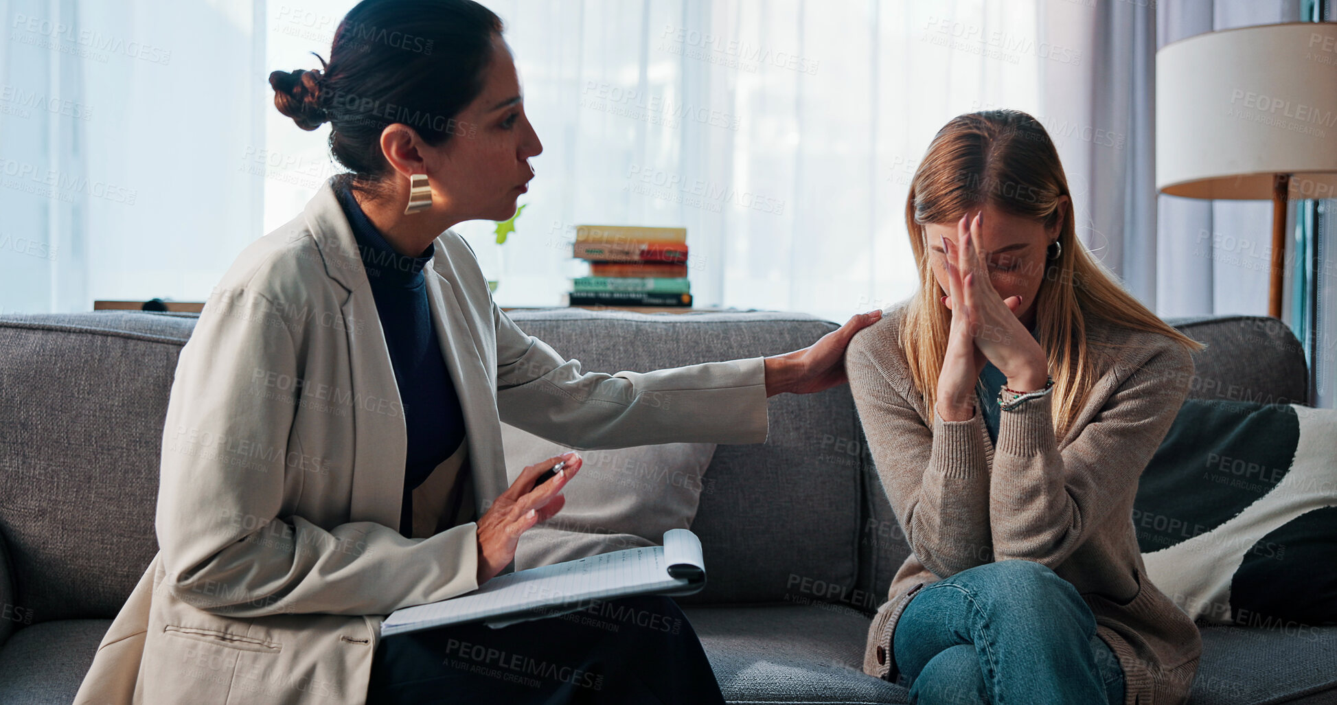 Buy stock photo Sad, woman and comfort with therapist for counseling, emotional support and empathy. Grief, psychologist and consoling patient with depression for compassion, trauma recovery and coping assistance