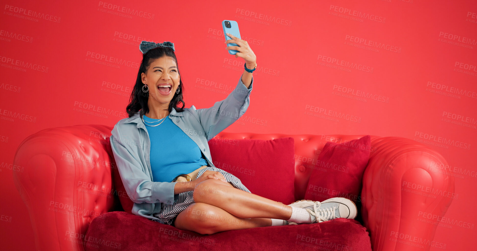 Buy stock photo Couch, relax and happy woman with selfie in studio, retro style and social media post for web update. Profile picture, excited person or photography on vintage sofa, capture moment or red background