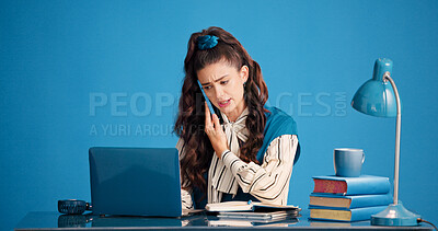 Buy stock photo Laptop, phone call and stress with woman in studio for business discussion, feedback or negotiation. Computer, conversation and problem solving with employee person on blue background for contact