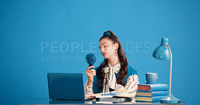 Buy stock photo Calm, woman and student with fan for heat, education and relax with breeze on break and mockup space. Blue wall, learn and person with mini air conditioner, knowledge and cool down for study session