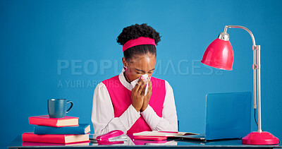 Buy stock photo Laptop, sick and black woman blowing nose in studio with allergies, flu or sinus infection. Computer, illness and African creative editor with tissue for sneeze with hayfever by blue background.