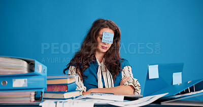Buy stock photo Burnout, tired and woman with sticky note in office, overworked and frustrated for mental exhaustion. Workload pressure, fatigue and person with do not disturb sign, overwhelmed and creative studio
