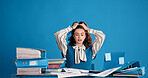 Studio, overwork and business woman with stress for financial crisis, frustrated and accounting. Burnout, accountant and person with tax mistake, deadline pressure and overwhelmed on blue background