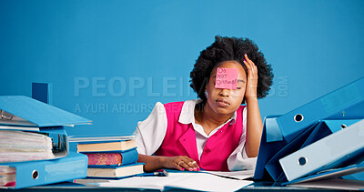 Buy stock photo Overworked, tired and black woman with sticky note in office, burnout and files for mental exhaustion. Workload pressure, fatigue and person with do not disturb sign, overwhelmed and creative studio