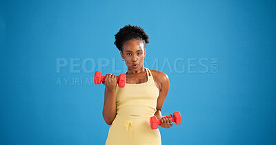 Buy stock photo Black woman, dumbbells and exercise in studio for portrait, weightlifting or strong on blue background. African person, bodybuilder and mockup space for training, fitness or gear for muscle in Kenya