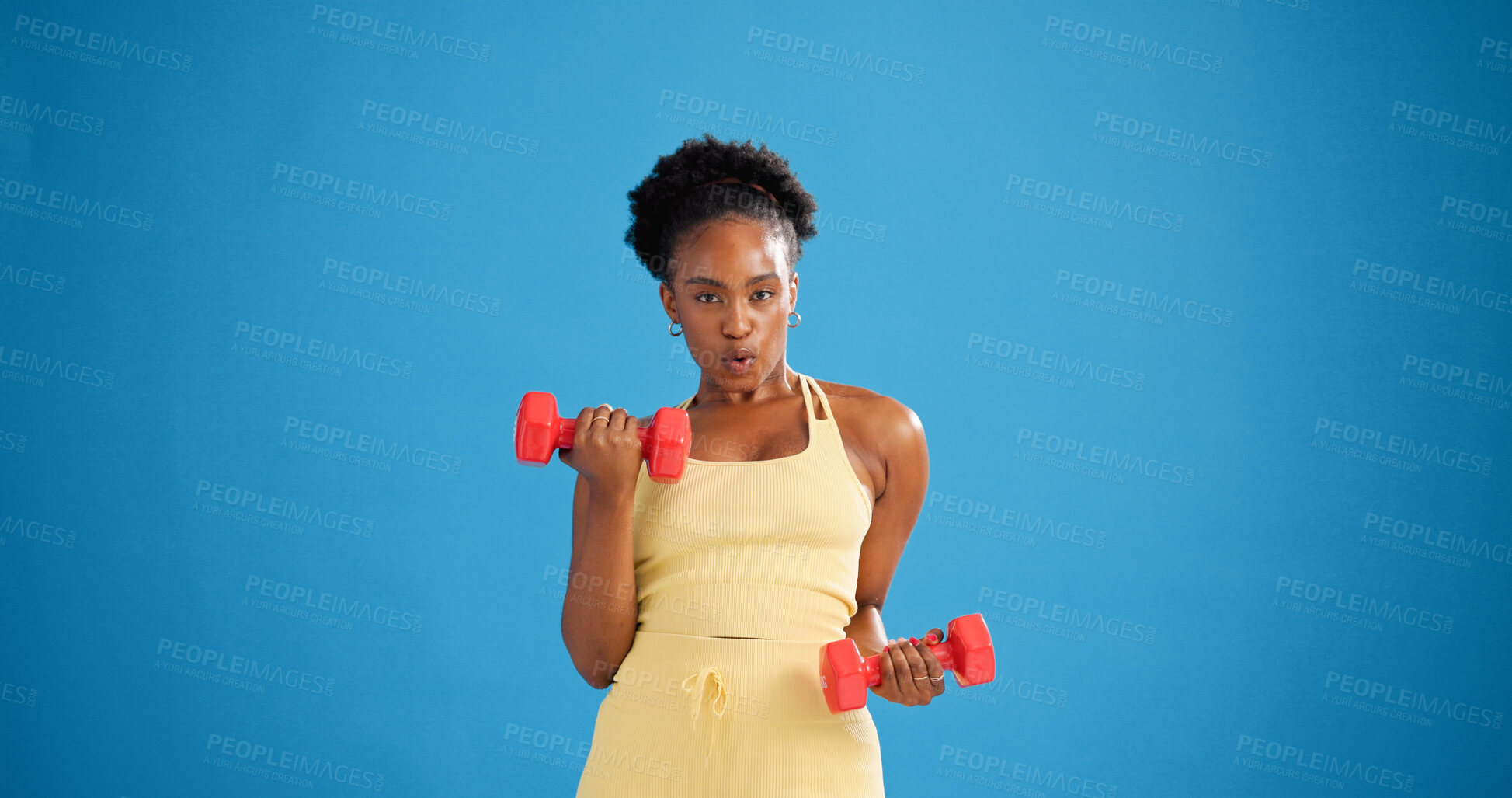 Buy stock photo Black woman, dumbbells and exercise in studio for portrait, weightlifting or strong on blue background. African person, bodybuilder and mockup space for training, fitness or gear for muscle in Kenya