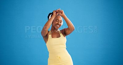 Buy stock photo Happy woman, fitness and dancing with headphones in studio, streaming or mock up space on blue background. Girl, smile and dancer with audio subscription, rhythm and listen to music for exercise