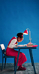 Business, black woman and laugh with notebook in studio for funny story idea, comic plot and mockup. Space, journalist and humor on blue background for article notes, creative planning or silly draft