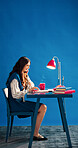 Laptop, phone call and smile with designer woman in studio for agenda, planning or schedule. Computer, journal and space with happy employee on blue background for communication or small business