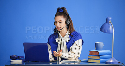 Buy stock photo Headset, laptop and stress with woman in call center for consulting, feedback or support. Computer, studio and question with agent on blue background for customer service, problem solving or review