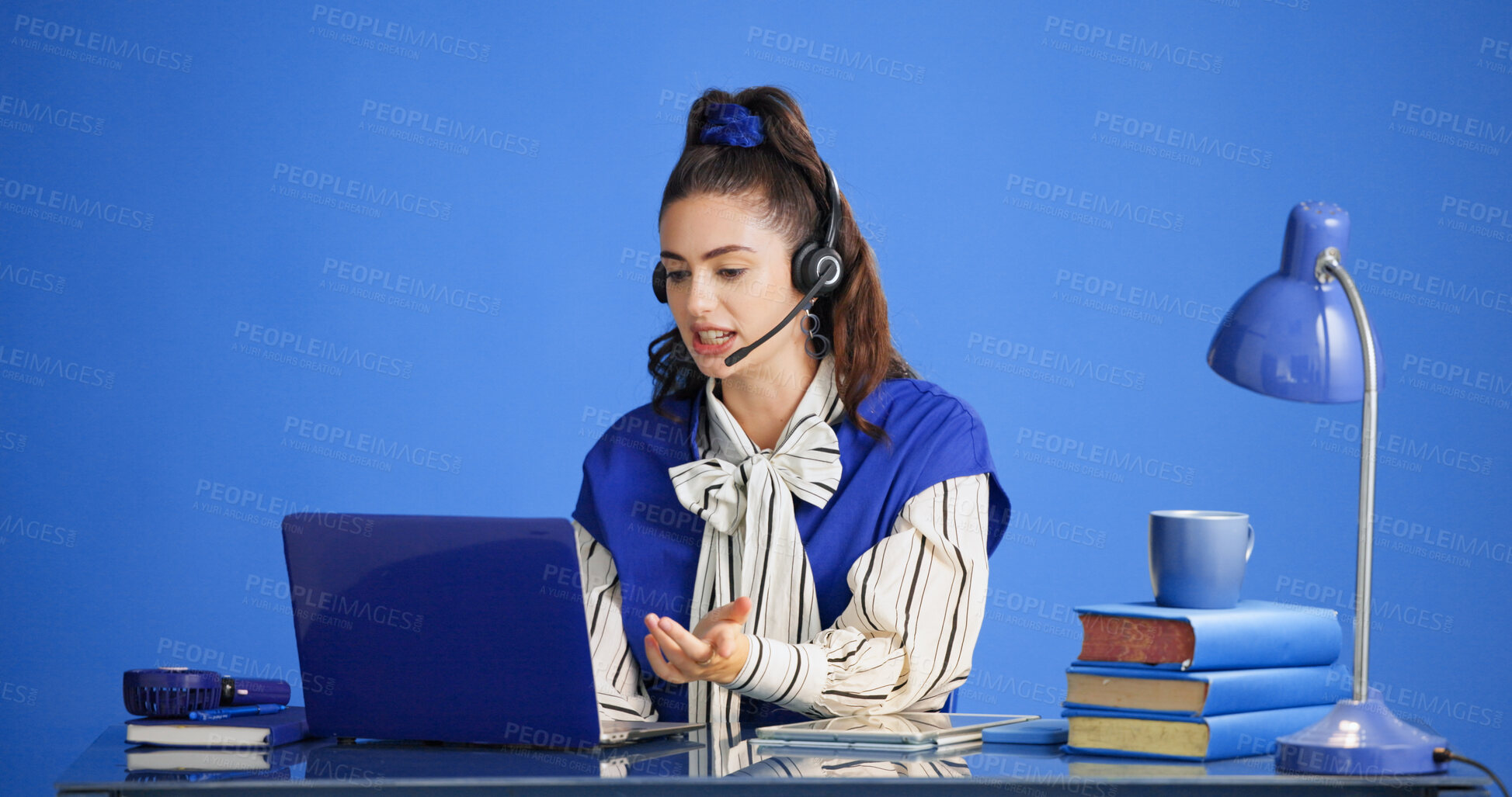 Buy stock photo Headset, laptop and stress with woman in call center for consulting, feedback or support. Computer, studio and question with agent on blue background for customer service, problem solving or review