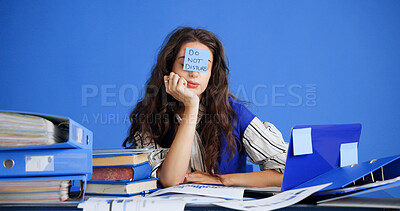 Buy stock photo Overwhelmed, tired and woman with sticky note in office, burnout and frustrated for mental exhaustion. Workload pressure, fatigue and person with do not disturb sign, overworked and creative studio