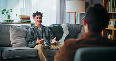 Buy stock photo Talking, sofa and man with psychologist in office for advice, help or life coaching session. Mental health, consulting and therapist with male patient for emotional support, wellness or conversation.