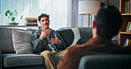 Conversation, sofa and man with psychologist in office for advice, help or life coaching session. Mental health, consulting and therapist with male patient for emotional support, wellness or talking.