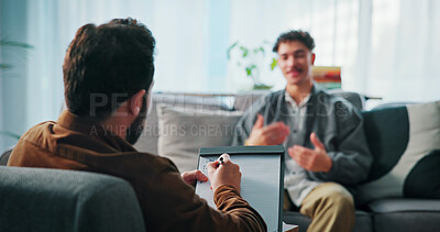 Buy stock photo Talking, clipboard and man with psychologist in office for advice, help or life coaching session. Mental health, notes and therapist with male patient for emotional support, wellness or conversation.