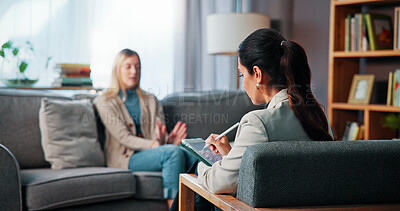 Buy stock photo Talking, notes and woman with psychologist in office for advice, help or life coaching session. Mental health, sofa and therapist with female patient for emotional support, wellness or conversation.