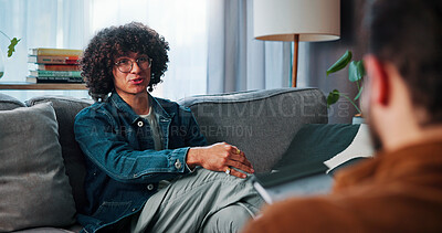 Buy stock photo Talking, sofa and man with counselor in office for advice, help or life coaching session. Mental health, consulting and therapist with male patient for emotional support, wellness or conversation.