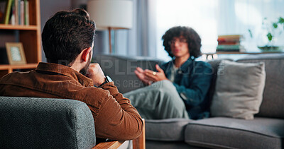 Buy stock photo Talking, sofa and man with psychiatrist in office for advice, help or life coaching session. Mental health, consulting and therapist with male patient for emotional support, wellness or conversation.