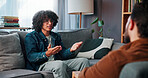 Consultation, therapist and man with communication, session and recovery and mental health in clinic. Counselor office, psychology and person on sofa for trauma, diagnosis or conversation for help