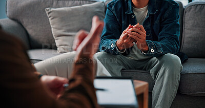 Buy stock photo Hands, anxiety and man on sofa by therapist for emotional support, help or advice on mental health. Nervous, notes and person with life coach for therapy, wellness or counseling session at clinic.