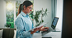 Woman, documents or finance with laptop in home for online investment, expenses or bills. Female person, freelancer or remote work with computer or paperwork for financial planning or budget in house