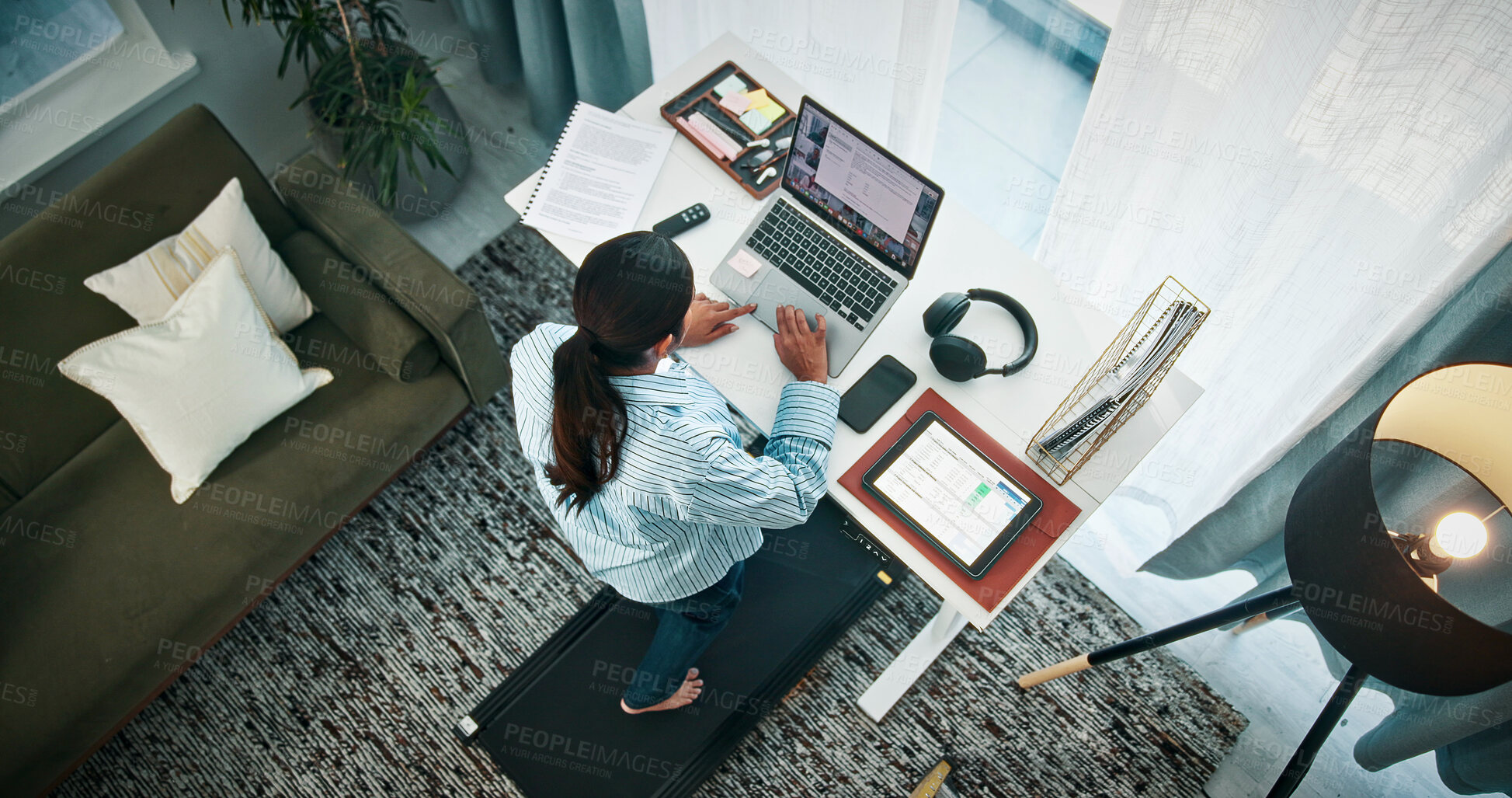 Buy stock photo Woman, treadmill or typing with laptop on standing desk above for productive day in home. Top view, female person or freelancer with computer, documents or tablet on walking pad for remote work