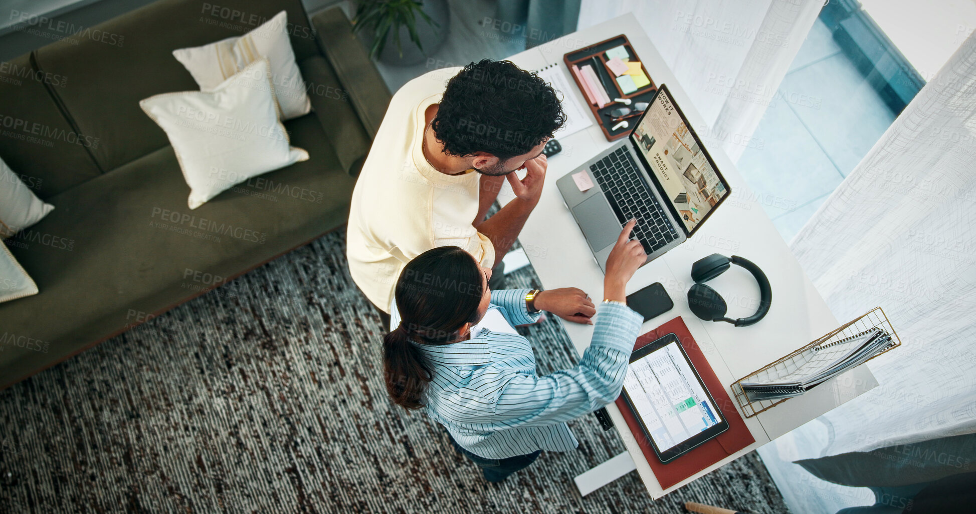 Buy stock photo Creative, couple and people with laptop in home office, discussion and planning for video submission. Above, man and woman with tech for content creation, pointing and remote work with standing desk