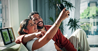 Buy stock photo Happy couple, relax and sofa with selfie in home for picture, photography or social media post. Man, woman or smile with capture moment or app for memory, relationship or bonding together in house