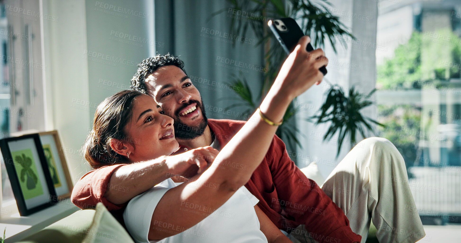 Buy stock photo Happy couple, relax and sofa with selfie in home for picture, photography or social media post. Man, woman or smile with capture moment or app for memory, relationship or bonding together in house