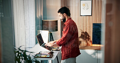 Buy stock photo Remote work, review or man in house with laptop, draft edit or source feedback for article update. WFH, proofreading or journalist in home with tech, fact check or industry research for publication.