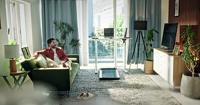 Buy stock photo Relax, weekend and man on sofa for watching tv, streaming series and movie subscription. Apartment, space and person on couch for rest, break and chill with entertainment, channel and show in home