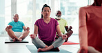 Exercise, meditation and senior woman in yoga class for awareness, inner peace or wellness. Balance, mindfulness and zen with person on floor in studio for holistic activity, development or health