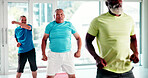 Elderly, people and stretching with class in studio for fitness, workout or exercise together. Senior, group or warm up with team in gym for physical activity, rehabilitation or recovery training