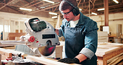 Buy stock photo Bandsaw, carpentry and eyewear with man in warehouse for manufacturing or production process. Earmuffs, ppe and sawing machine with person in woodworking plant to resize lumber or timber for project
