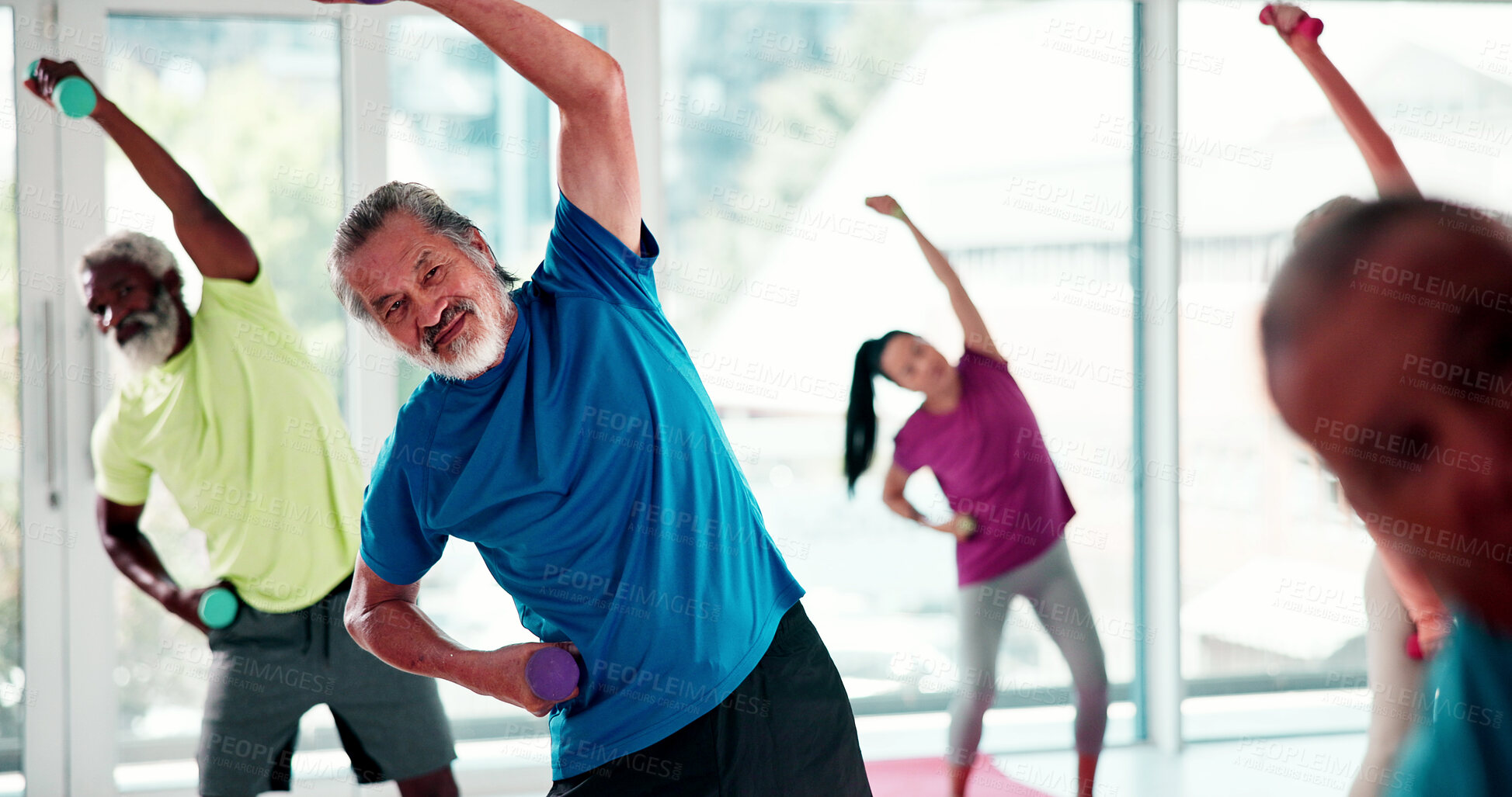 Buy stock photo Senior, people and stretching with instructor in class for fitness, workout or exercise together. Elderly, group or warm up with personal trainer in gym for physical activity or muscle rehabilitation