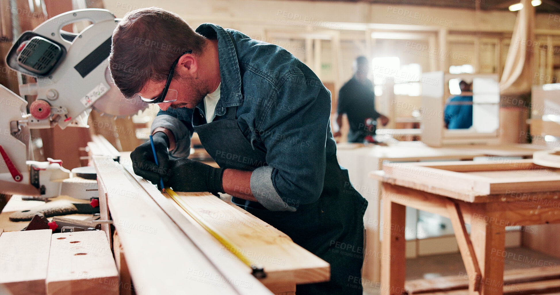 Buy stock photo Carpentry, writing and man with tape measure in workshop, construction process and planning for precision. Tools, woodwork and carpenter with plank for creative project, material preparation or craft