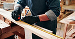 Measuring tape, carpenter and man in workshop for project, planning and manufacture furniture. Industry, craft and male woodworker with equipment on timber material for small business in factory.