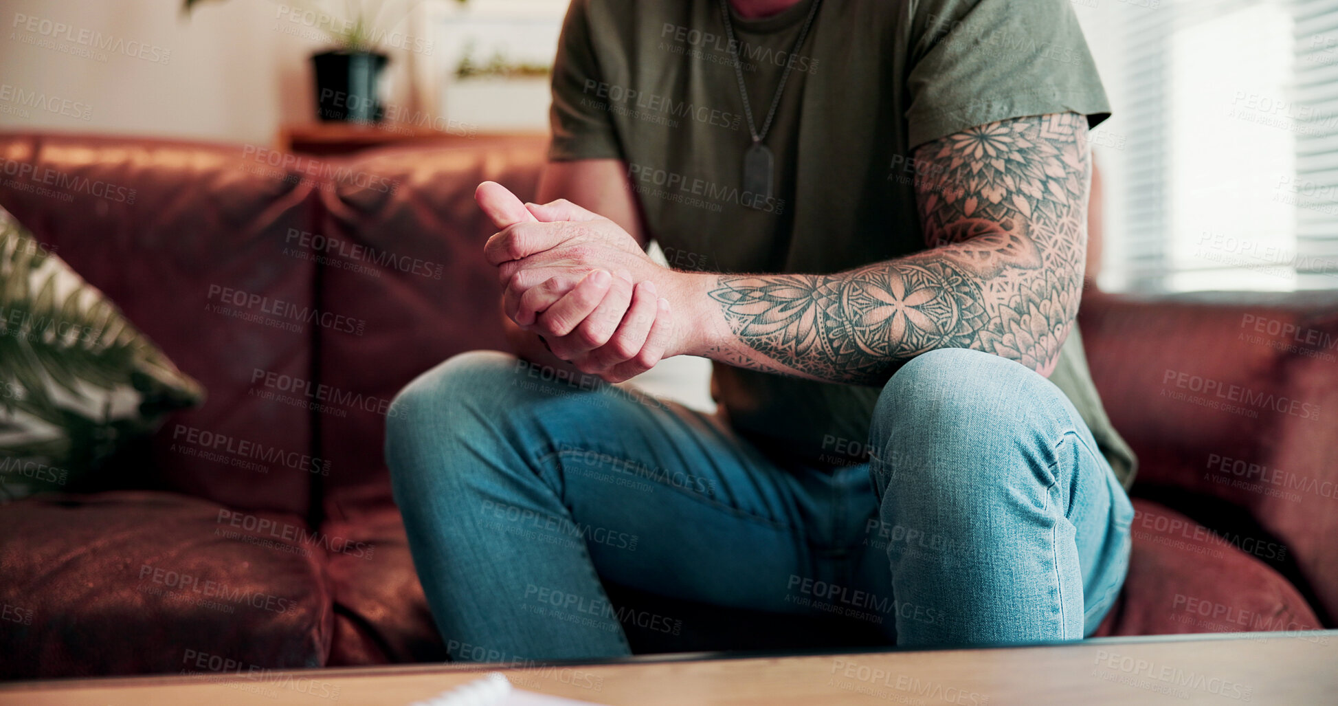 Buy stock photo Hands, stress and man on sofa at psychology office for help on mental health with medical service. Assessment, anxiety and male person with depression in therapy session for wellness at clinic.